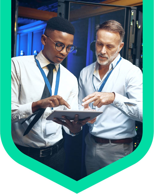 A student on one of our Degree Apprenticeships working with a colleague