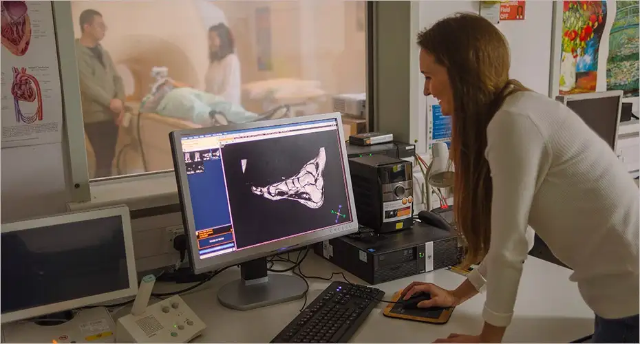 Student looking at x-ray on pc