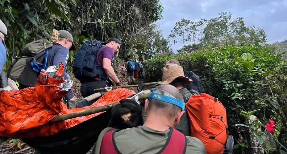 Close up of Extreme Medicine students carrying a dummy patient through a wilderness environment