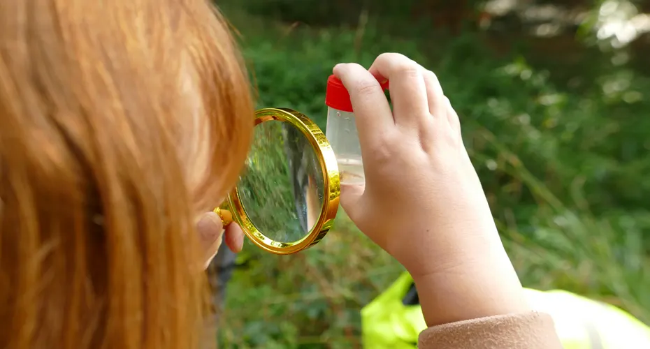 girl with magnifying glass