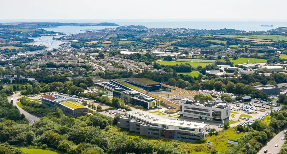 An aerial shot of penryn campus and the coast.