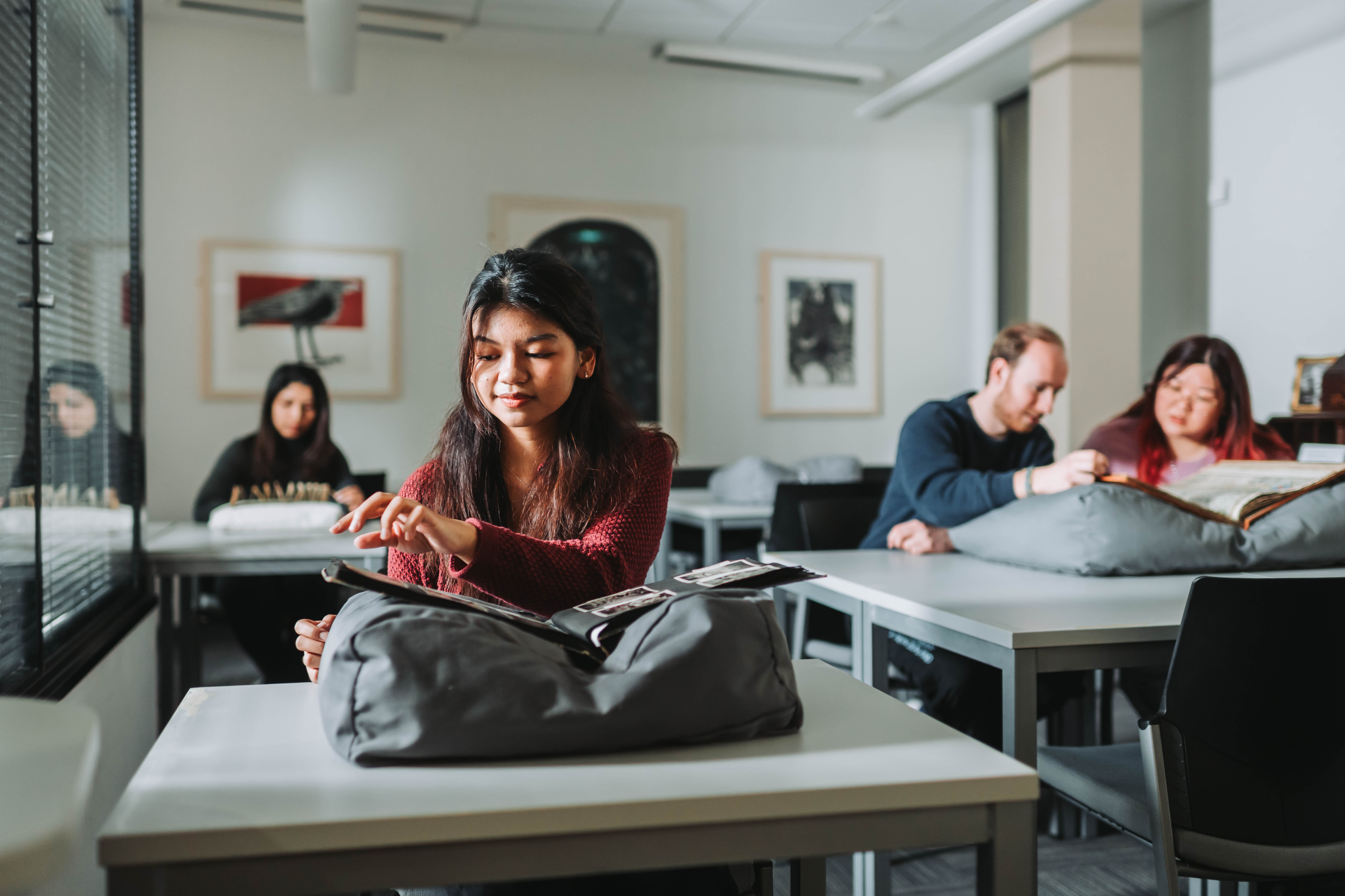 Students looking at material in the Ronald Duncan Reading Room