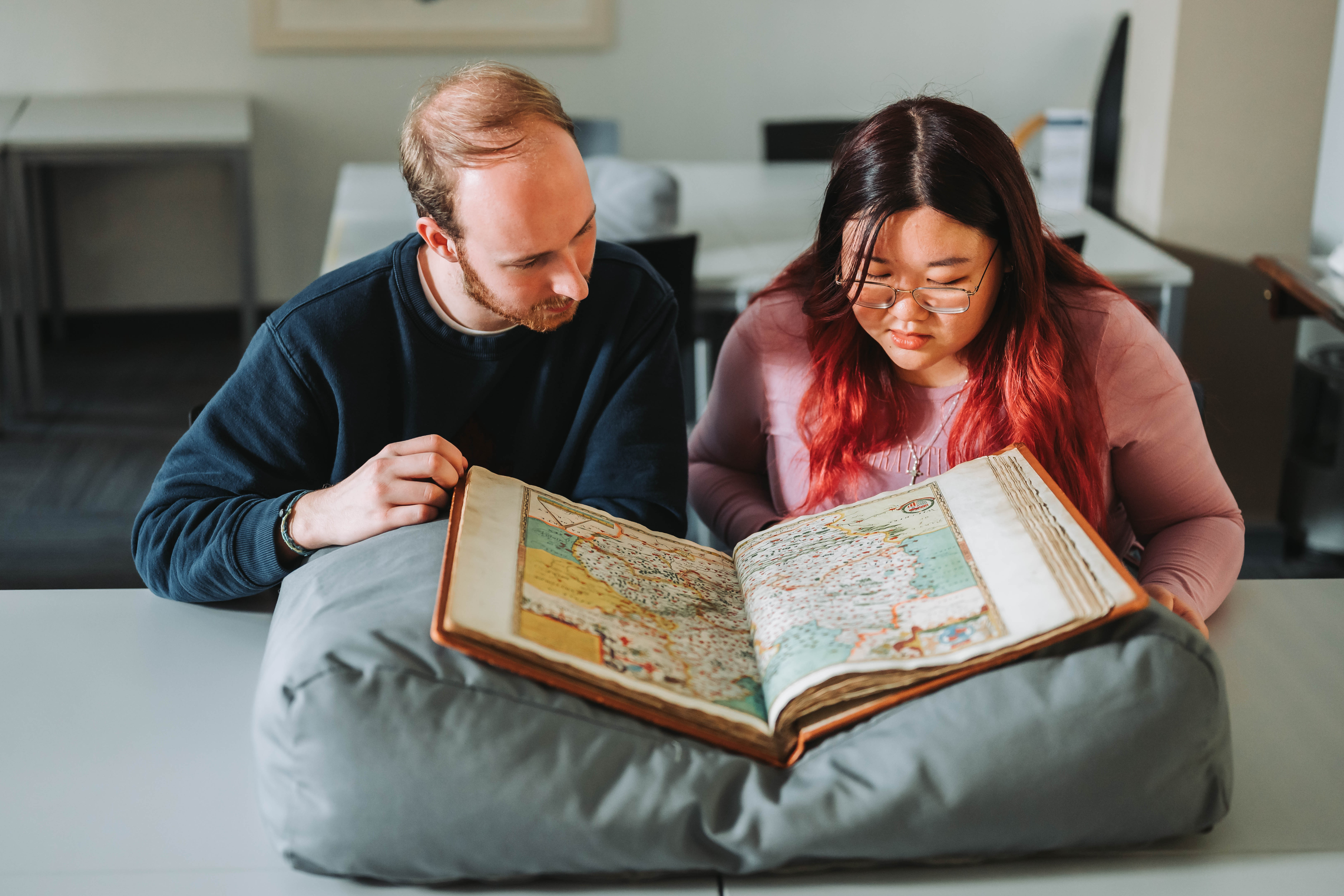 Students looking at Saxton Map in the Ronald Duncan Reading Room