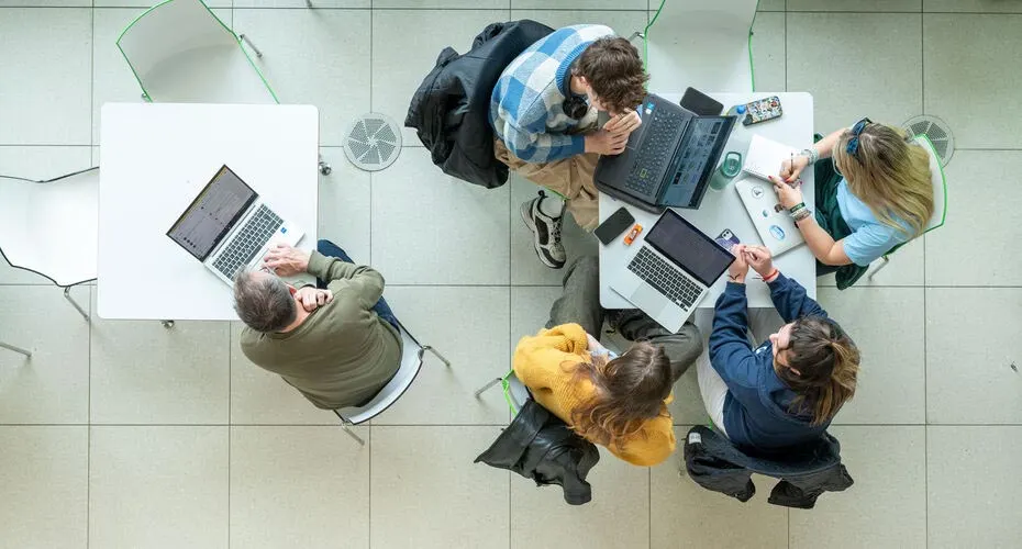 Students workong on laptops at the BUsiness School